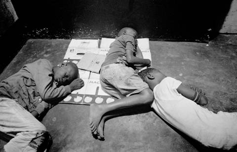 With no home or parental care, street children sleep together for warmth and protection. © 2005 Marcus Bleasdale